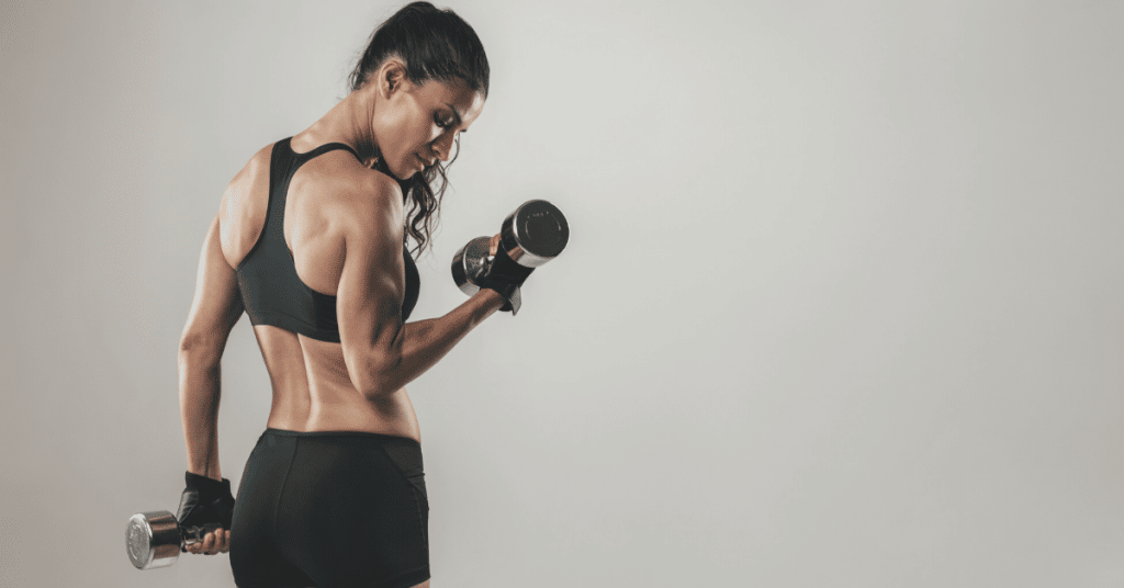 Personal Trainer lifting weights for insurance blog post