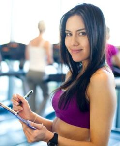 A client filling out forms for personal trainers insurance