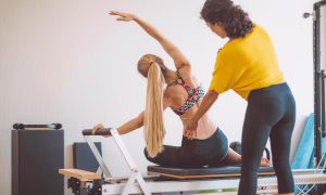 pilates instructor working with a client