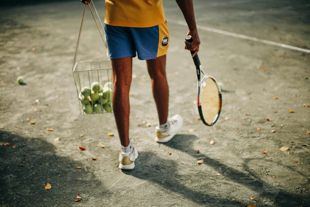 Tennis player walking onto the court