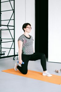 woman stretching on floor