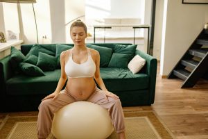 pregnant woman using exercise ball