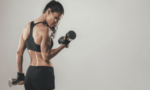 Personal Trainer lifting weights for insurance blog post