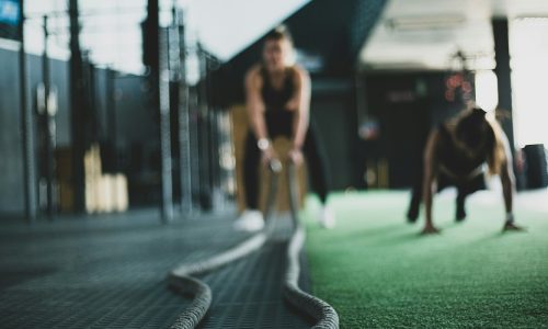 A woman works out with rope exercises.